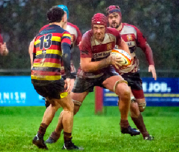  Jake Clifford tries to get away from Saltash’s Greg Eatwell      
