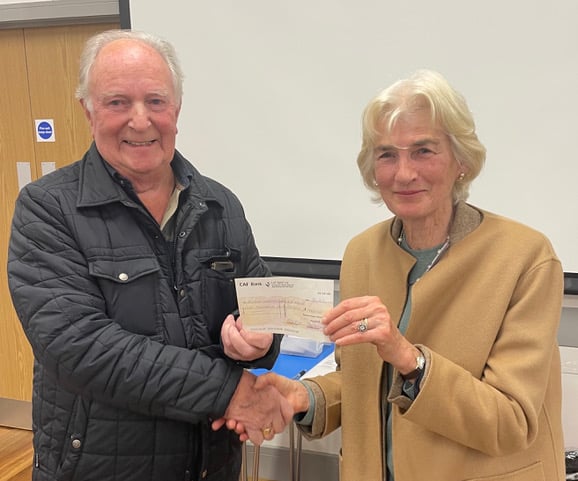 A cheque for £1,000 is presented by Peter Bray, of the National Grid Benevolent Fund, to Susie Gore, chairman of Bodmin Hospital League of Friends