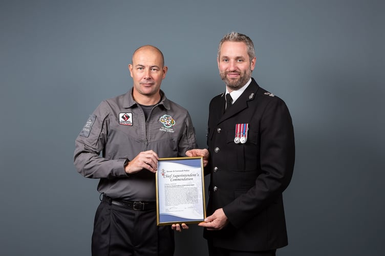 Tri-Service support officer Adrian Hart receives his Chief Superintendent’s Commendation from CS Ben Deer