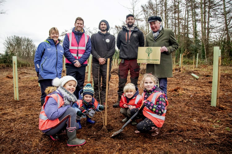 Lord St Levan and Kerry Rice from St Aubyn Estates with tree surgeons and pupils from St Hilary School helping to play trees in Friendship Woods