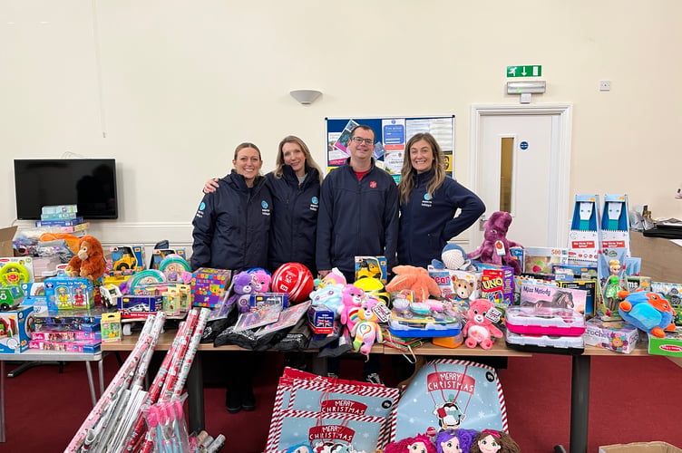 Gemma Taylor, Binie Barnes, Martyn Coles (Salvation Army) and Rosina Perry with the toys donated by Aspects Holidays