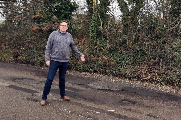 Cllr Richard Pears highlighting a pothole