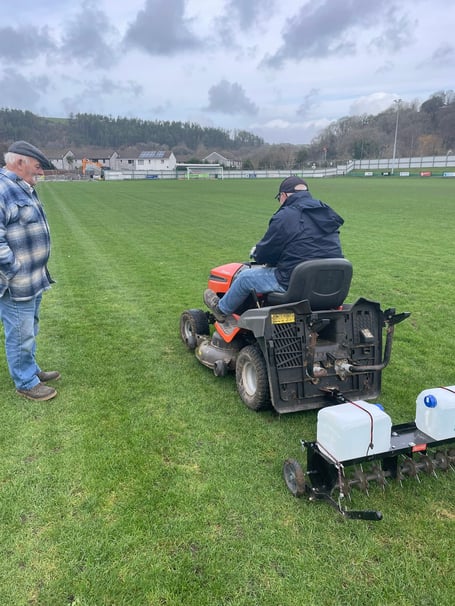 Groundsmen working on the playing surface at St Blazey on Friday.