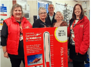 Costain staff Sharon Adams, John Green and Debbie Piper flanked by Karen Hurn and Julia Jeffery from the Cornwall Air Ambulance team at the scheme’s Carland Cross site offices