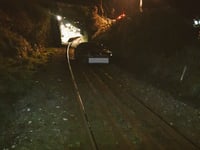 Car abandoned on railway track