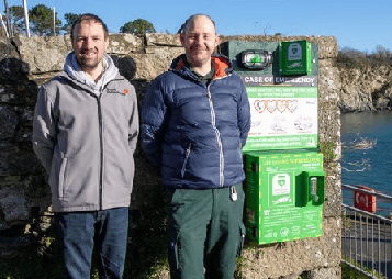 Alan Odgers of Duchy Defibrillators and Christian Brown, of FLEET, with the new defibrillator at Porthpean