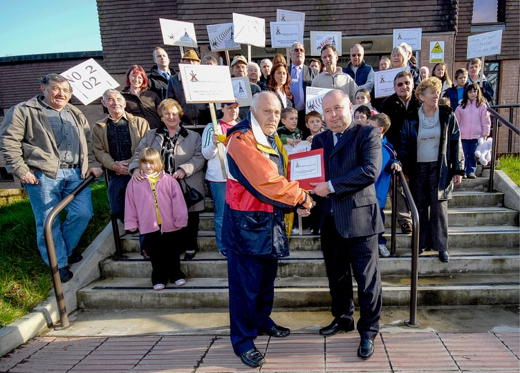 Protesters hand over a petition to Gareth Pirwell, then chief executive of Restormel Borough Council, about the erection of a mobile phone mast in Bethel, March 2007