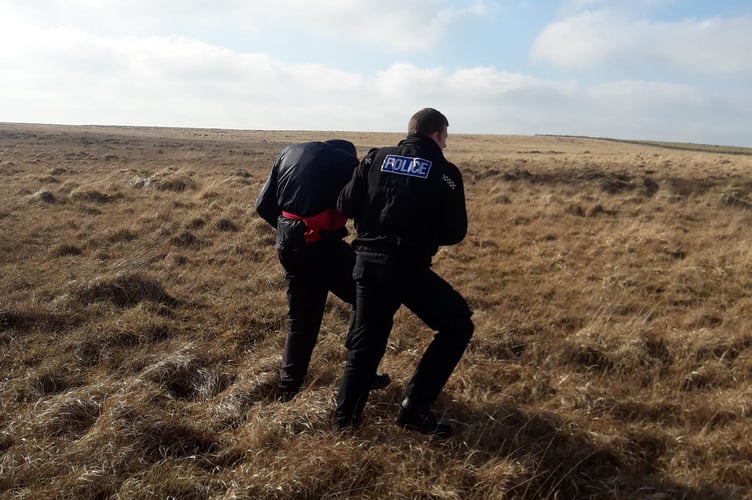 Police rescuing the 72-year-old man on Bodmin Moor