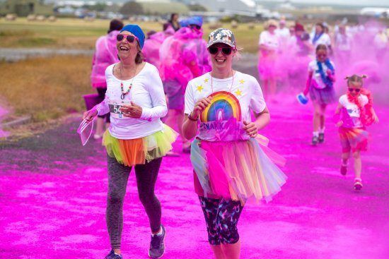 Runners enjoying their colourful day out getting covered in powder paint. Picture: Andy Watkins (Giantaphotography.co.uk)