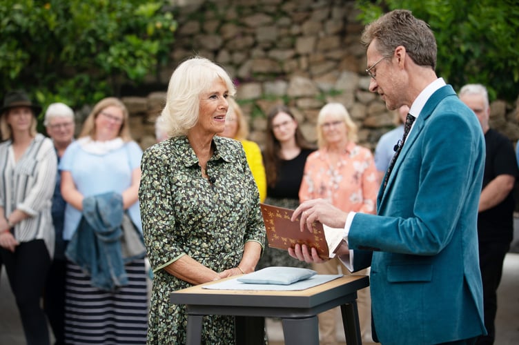 Her Majesty the Queen Consort brings a book to the Roadshow. Photographer - Anna Gordon. Copyright - Antiques Roadshow, BBC Studios.jpg