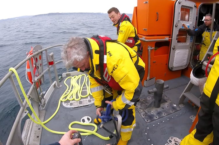 Fowey RNLI crew working on the tow