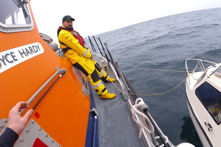 Fowey RNLI take the fishing boat under tow