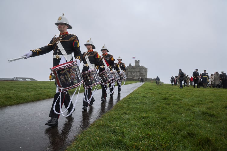 Pictured: Royal Marines Band Corps Drums at Pendennis Castle for the Armed Forces Day Launch in Falmouth.

Members of the Armed Forces joined local communities across Cornwall today to mark 100 days to go until the Armed Forces Day national event, taking place in Falmouth on 24 June.
Amid the backdrop of Pendennis Castle, service personnel from across the Royal Navy, British Army and Royal Air Force raised the official Armed Forces Day flag, declaring the countdown as having officially started.
Adding to th