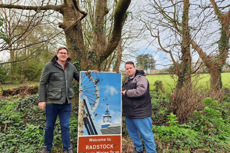 St Austell councillors Richard Pears and James Mustoe with the Radstock sign
