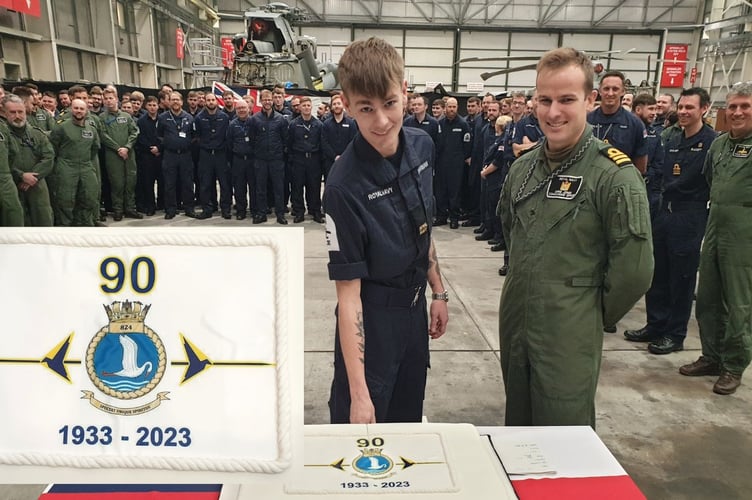 Ryan Sharman cut the cake alongside commanding officer Chris Jones