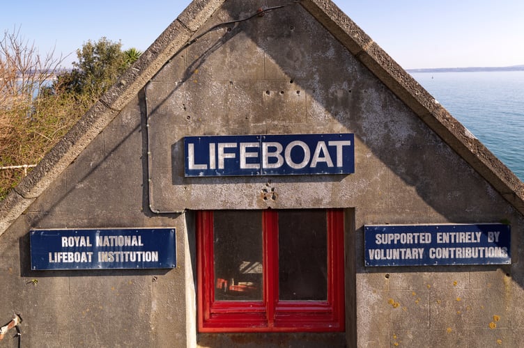 Penlee Lifeboat House and Slipway, Penlee Point, Mousehole, Cornwall.
Detail view of  west elevation to road showing  upper window and signage. View from west. Built 1911-13 to a design by W. T. Douglass, engineer and architect to the Royal National Lifeboat Institution.