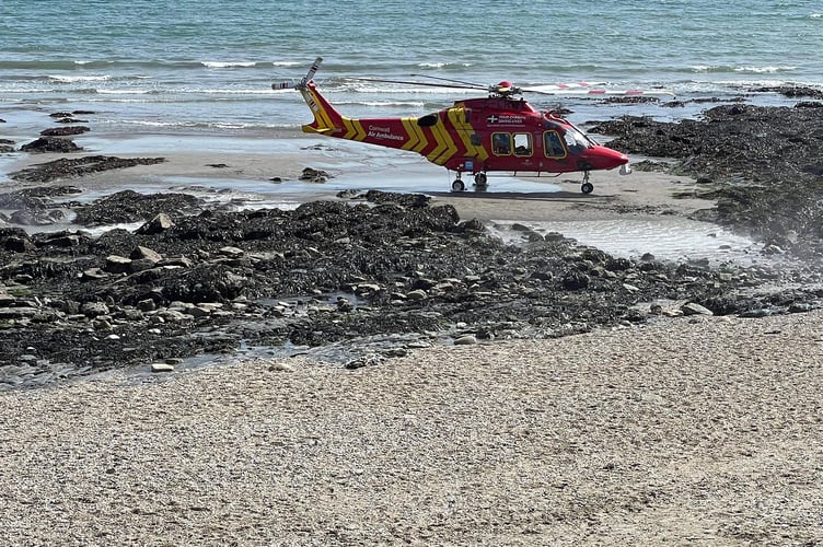 Charlestown beach and quay had to be evacuated on Saturday when the Cornwall Air Ambulance was called out to an injured person.  St Austell Coastguard took the initial call and were first on the scene, stabilising the casualty while awaiting support from the South Western Ambulance Service and Cornwall Air Ambulance. Mevagissey Coastguard also helped out. “We were paged at 12.22 hours to assist St Austell Coastguard with a medical emergency at Charlestown Harbour, after a lady fell on the rocks,” said a spokesperson. “Cornwall Air Ambulance conducted an impressive manoeuvre by hovering just above the ground, allowing the medical crew to alight on scene. The helicopter then landed at St Austell Rubgy Club. Thank you to the public who evacuated from the beach and harbour wall to allow the aircraft to approach.”
