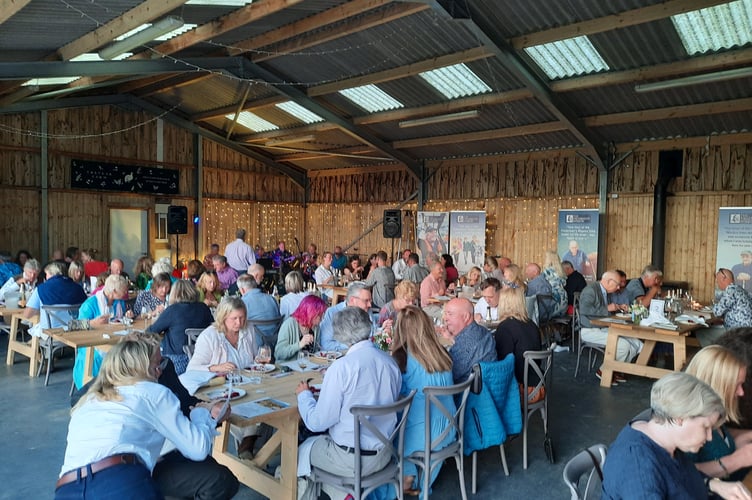 Guests enjoying the diner in the barn looking over Padstow