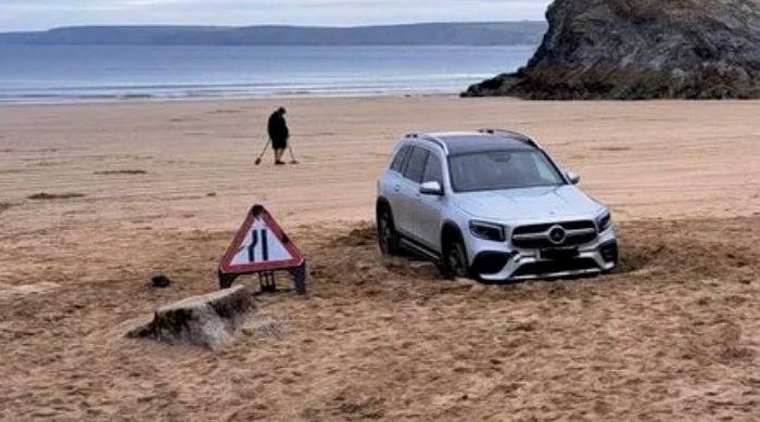 ***MANDATORY CREDIT: The Cornish Pasty Box / SWNS***

An SUV had to be towed from a beach in Cornwall after it got stuck in the sand.The Mercedes 4x4 vehicle became wedged on Town Beach in Newquay on Thursday morning before it was towed away. See SWNS story SWLNcar. The beach does have a slip road, but only for authorised vehicles to use.Darren Bassett, 51, who runs The Cornish Pasty Box, said: "Thankfully it was towed before high tide came it. It would have completely washed it out to sea.


