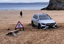 Warning after car becomes stuck in sand at Newquay beach