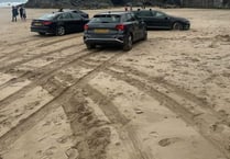 Beachgoers left bemused after four drivers became stuck in the sand