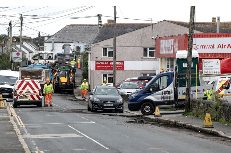 Highways staff worked around a car left on Clifden Road in St Austell on Monday
