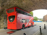 Double-decker bus hits railway bridge