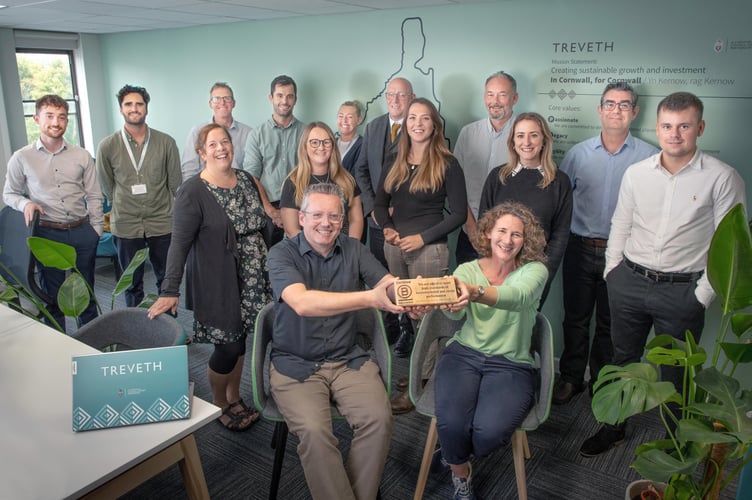 Treveth Holdings LLP, Truro. Greg Slater and Catherine Pinney holdiing the B Corp trophy,  with the team.