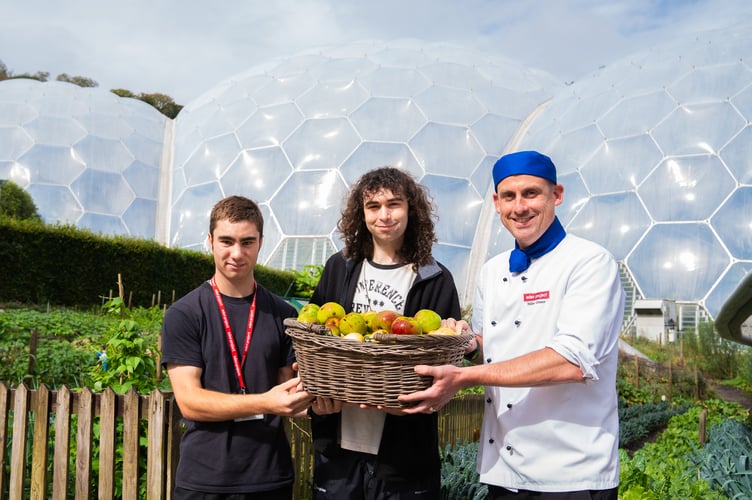 Kyle White and William Kenyon present harvested apples to Eden head chef Mike Greer