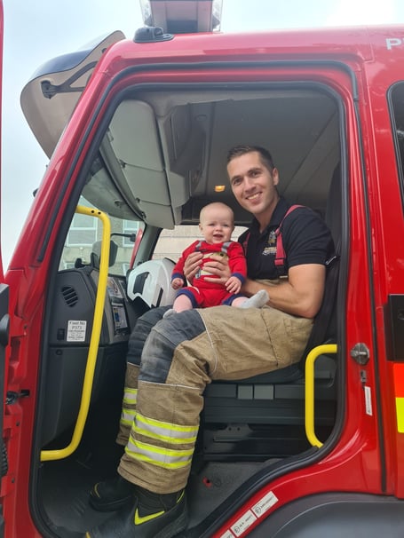 Owen Hodgson with his baby