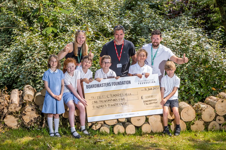 Trevisker Primary School receiving their funds from the Boardmasters Foundation