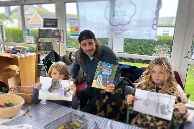 Joseph Johnson doing storytime with some youngsters and, below, some illustrations from his book