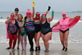 Superheroes take a cold dip to raise money for charity
