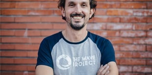 The founder of a Newquay surf therapy charity  is stepping down 