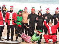 Santa and his helpers hit the surf in Newquay for good cause