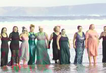 Swimmers take on New Year's Eve dip in their ballgowns 