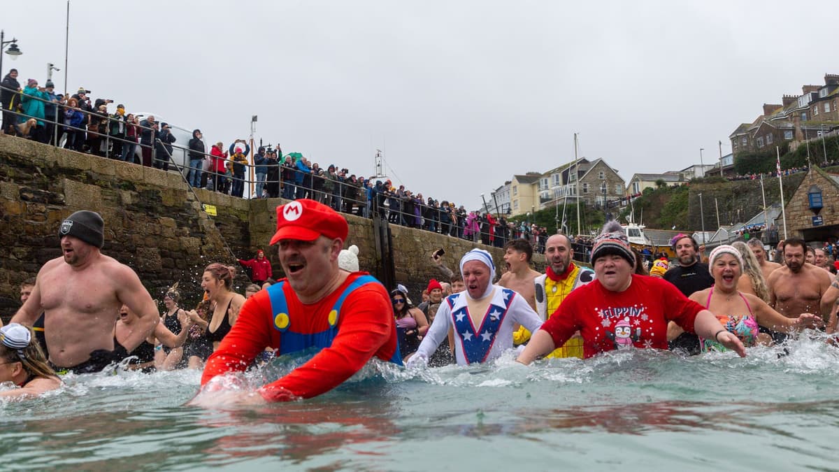Brave swimmers take the plunge for New Year's Day charity dip in ...