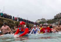 Brave people take the plunge for New Year's Day charity dip in Newquay