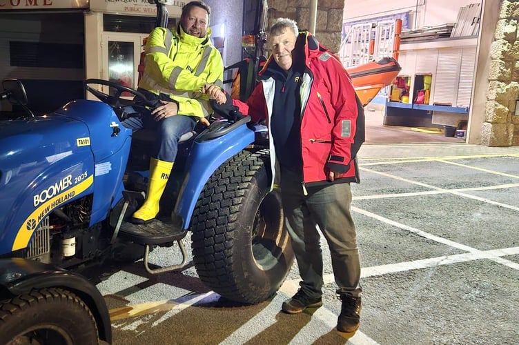 Richie Law on left being congratulated by RNLI Asssessor Trainer Gary Stanbury on qualifying as RNLI tractor driver