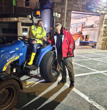 Richie Law on left being congratulated by RNLI Asssessor Trainer Gary Stanbury on qualifying as RNLI tractor driver