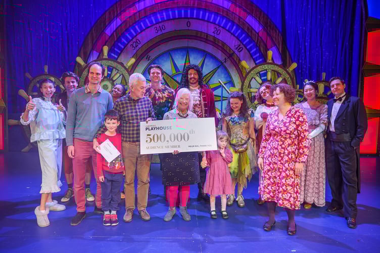 HALL FOR CORNWALL, TRURO, ENGLAND - December 29th 2023 :  The 500,000th member of the public to buy a ticket for a performance at the Cornwall Playhouse, receives their prize from the cast of Peter Pan, on stage, photographed by HfC photographer in residence Hugh Hastings.
