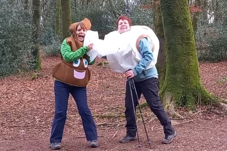 Charity walkers dressed as a poo emoji and toilet roll