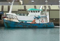 Bid to get rid of boat left to rot in harbour