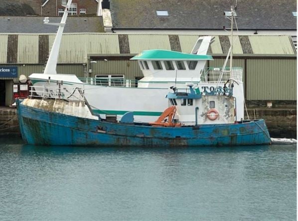 Bid to get rid of boat left to rot in harbour