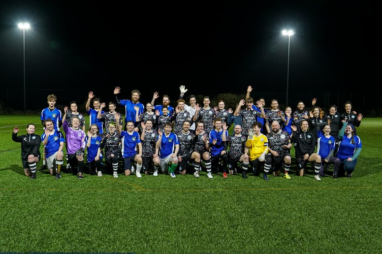 HALYE, CORNWALL, ENGLAND - February 4th 2024 : Players from Stargazy FC, CornwallÕs first LGBTQ+ football club and the newly created Hall for Cornwall football team, line-up for a friendship team picture prior to their match, photographed by HfC photographer in residence Hugh Hastings. 