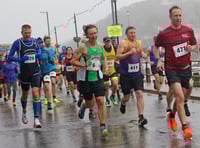 Watch brave runners battle heavy rain to take part in the Looe 10 