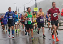 Watch brave runners battle heavy rain to take part in the Looe 10 