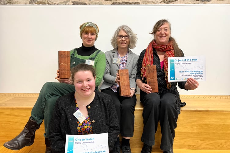 Daisy Stevens, Kate Hale, Bec Applebee and Tammy Bedford show off the awards the Isles of Scilly Museum won