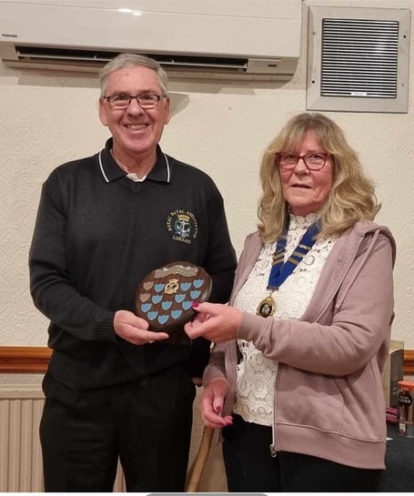 Terry Whitty being presented the award by the chairman of the Royal Naval Association chairman, Marie Belfitt