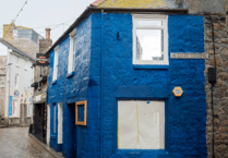 'Smurf blue’ shop repainted after complaints